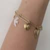 Bijou acier inoxydable, bracelet  chaine rétro vintage à maillons et pendentifs coeur en pierre naturelle de nacre, d‘hirondelle de nacre, d‘écu et de trèfle 