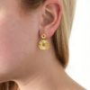 boucles d'oreilles pendantes composées de deux petites nénufars en acier inoxydable