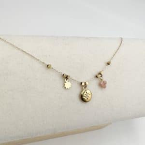 Bracelet très fin en acier inoxydable doré avec petite rose des vents