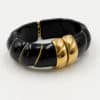 Bracelet torsadé de type jonc, manchette, en acier inoxydable et acétate de couleur Noire