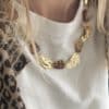 Collier en acier inoxydable et perles d'acétate couleur ambre