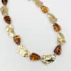 Collier en acier inoxydable et perles d'acétate couleur ambre