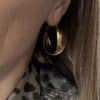 Boucles d'oreilles créoles torsadées en acier inoxydable de couleur dorée