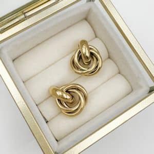 Boucles d'oreilles rétro vintage en acier inoxydable doré. Bijou en acier inoxydable
