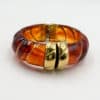 Bracelet torsadé de type jonc, manchette, en acier inoxydable et acétate de couleur ambre