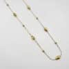 Collier sautoir avec gouttes en acier inoxydable doré